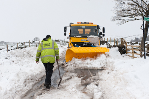 Winter-Gritter operative clearing roads in Diggle